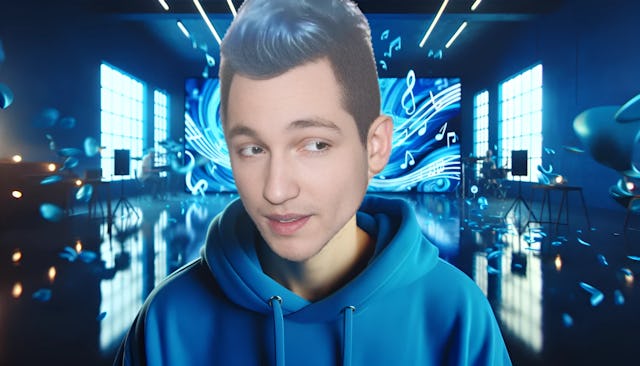 Rezo, bald and fair-skinned, wearing a blue hoodie, against an abstract musical background in a modern setting