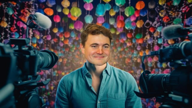 Phil Laude, confidently performing stand-up comedy in a crowded club, holding a microphone, with stage lights in the background.